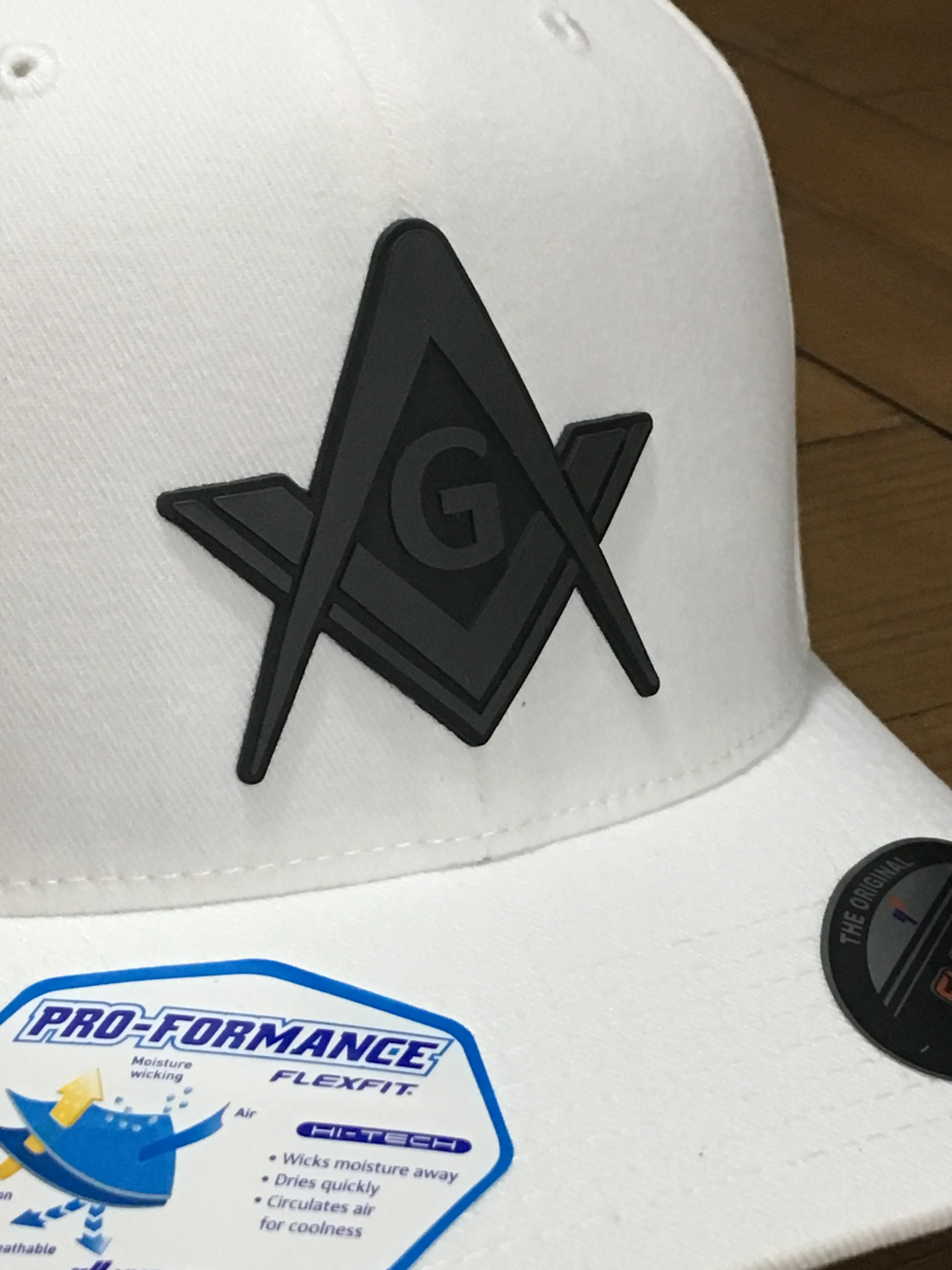 The Signum Cap - rubberized Square and Compass fitted caps